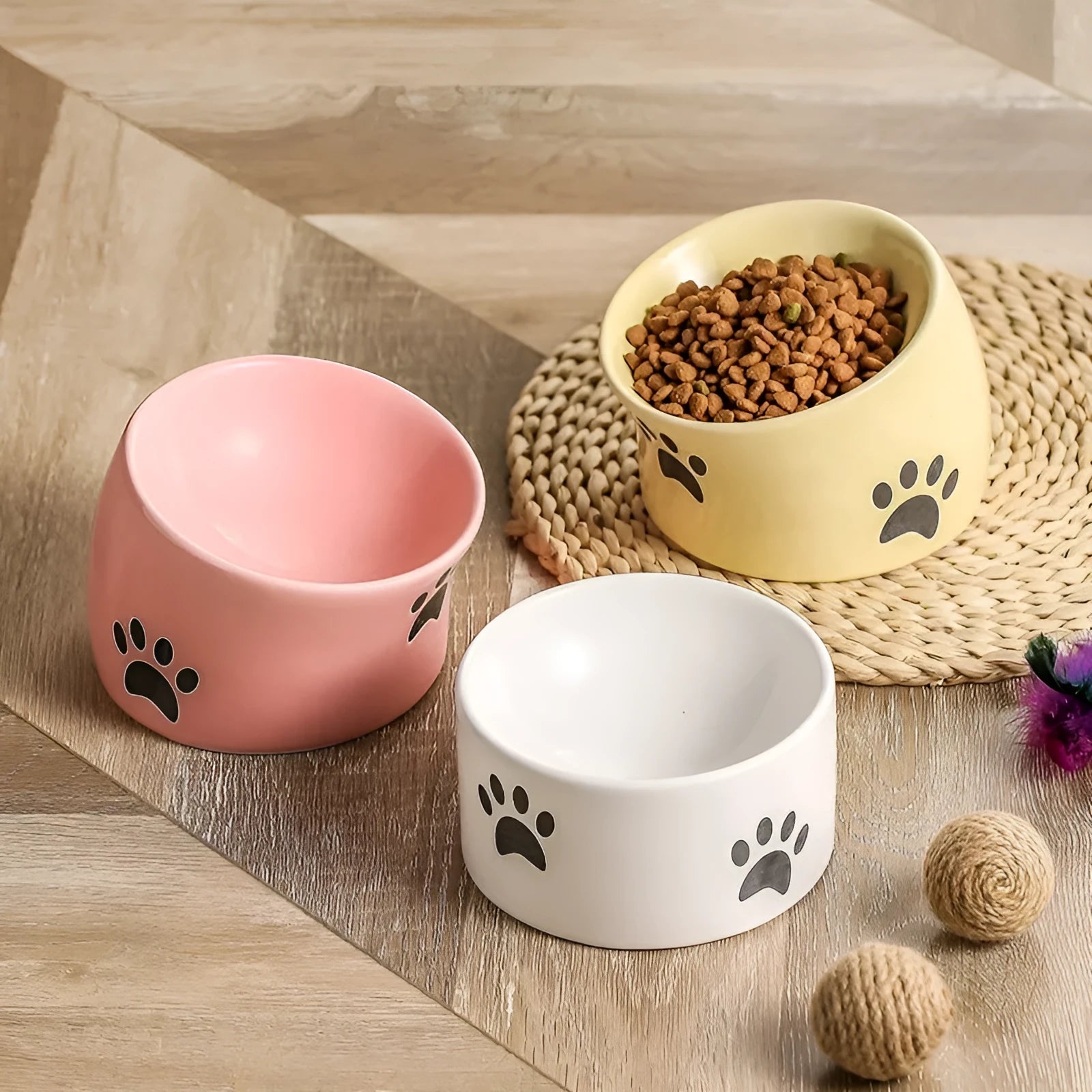 Ceramic cat bowl with high-foot design and cat's paw pattern in choice of colours