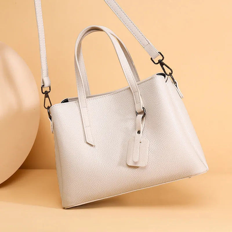 Cowhide leather women's shoulder handbag in khaki with multiple compartments and business styling