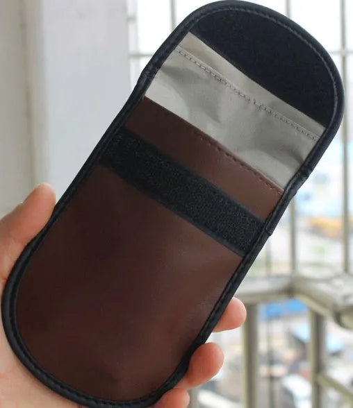 Black microfiber faraday bag for blocking car key fob and RFID card signals.