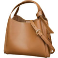 Genuine leather women's crossbody bag in tea brown showing bucket shape and crossbody strap