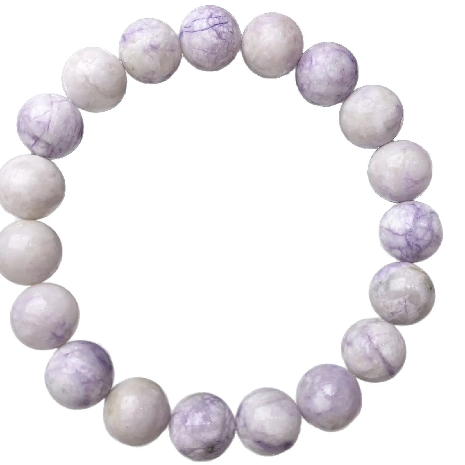 Close-up of a women's bracelet with natural purple turquoise beads on a wrist.