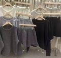 Women's knitted loose-fitting sweater and wide-leg shorts two-piece set in a neutral colour.