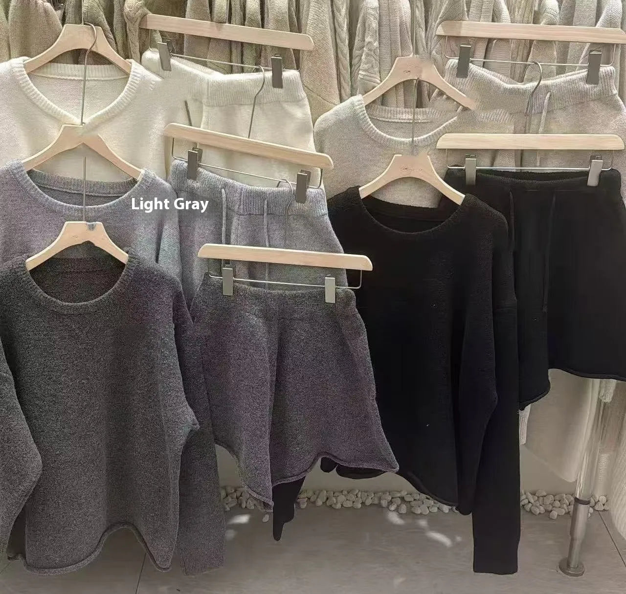 Women's knitted loose-fitting sweater and wide-leg shorts two-piece set in a neutral colour.