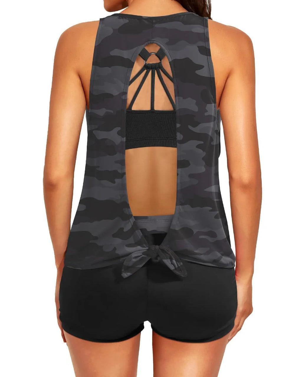 Women's printed three-piece swimsuit set with short sleeve top, vest, and shorts in peacock blue, showing hollow backless design and covered belly.