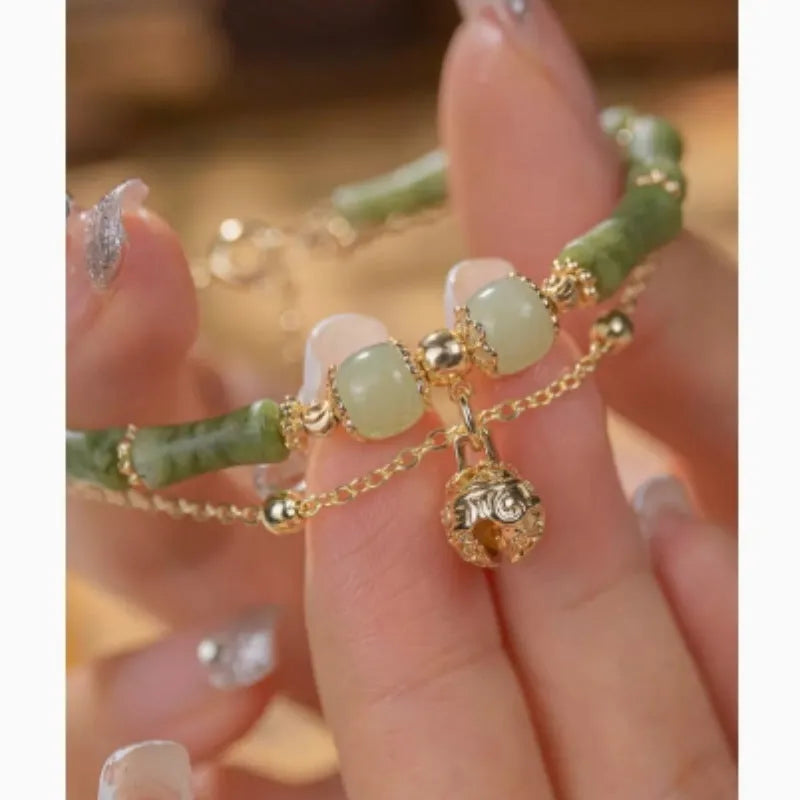 Women's natural Hetian jade bamboo bracelet on white background, adjustable 15+3 cm size