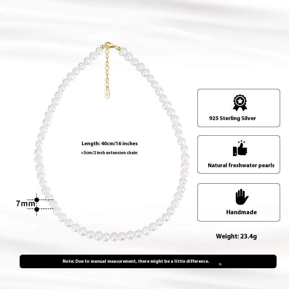Women's silver necklace with round natural freshwater pearls on an adjustable chain.