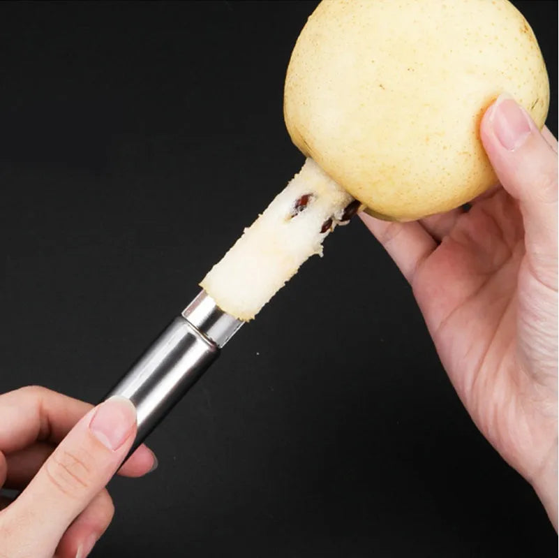 Stainless steel pineapple corer slicer with coloured ABS handle on a kitchen counter
