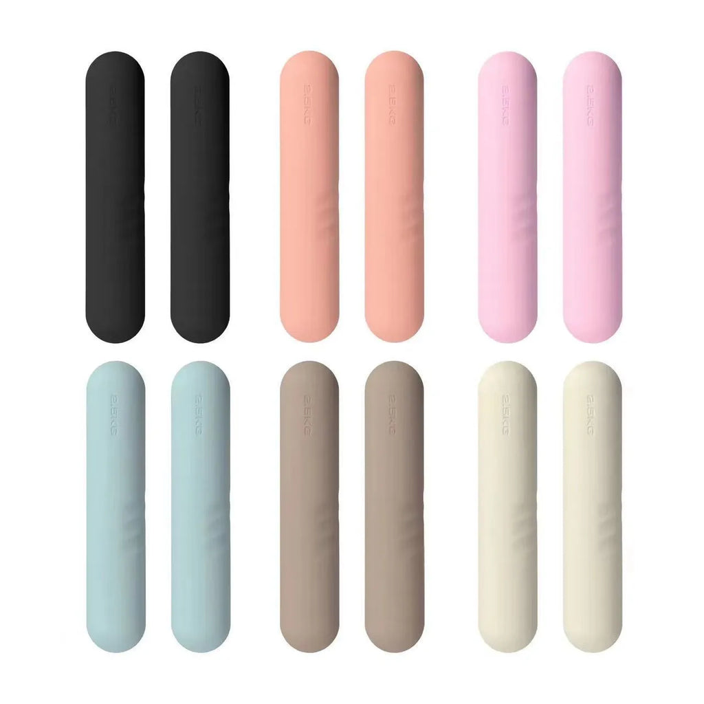 Silicone non-slip edging on a hand-drawn cast iron dumbbell stick in various colours and weights.