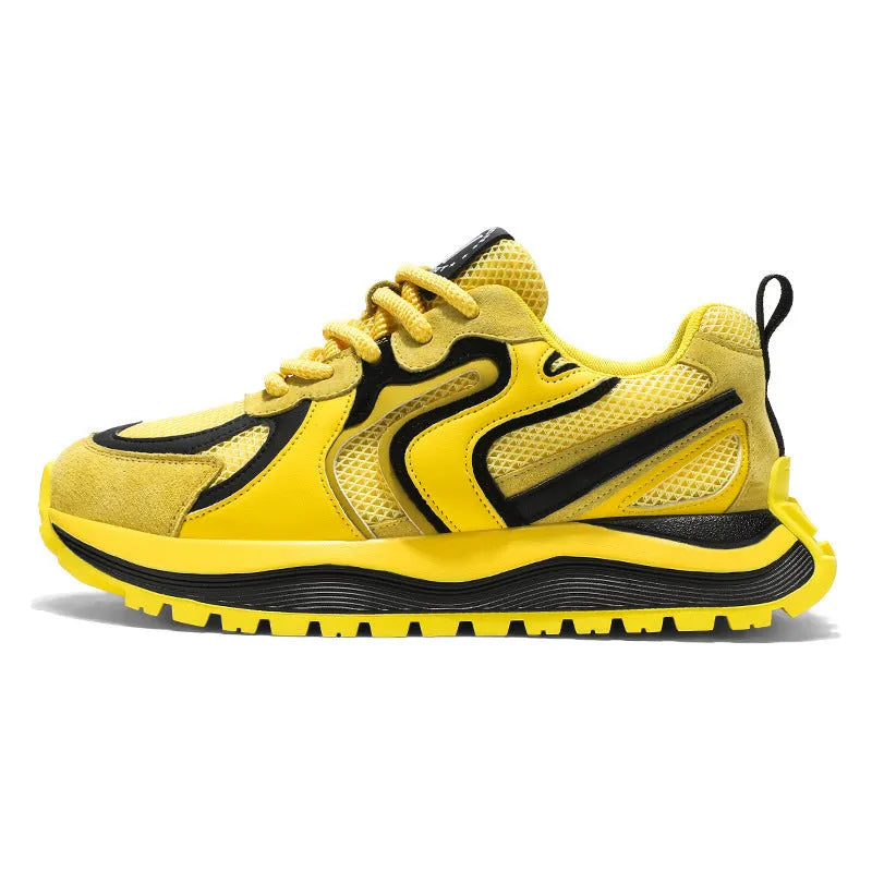 Men's yellow, black, and white mesh and synthetic leather casual sneakers with round toe and lace-up front.