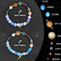 Set of twelve natural stone beaded bracelets, each with a different zodiac sign charm on an adjustable strap.