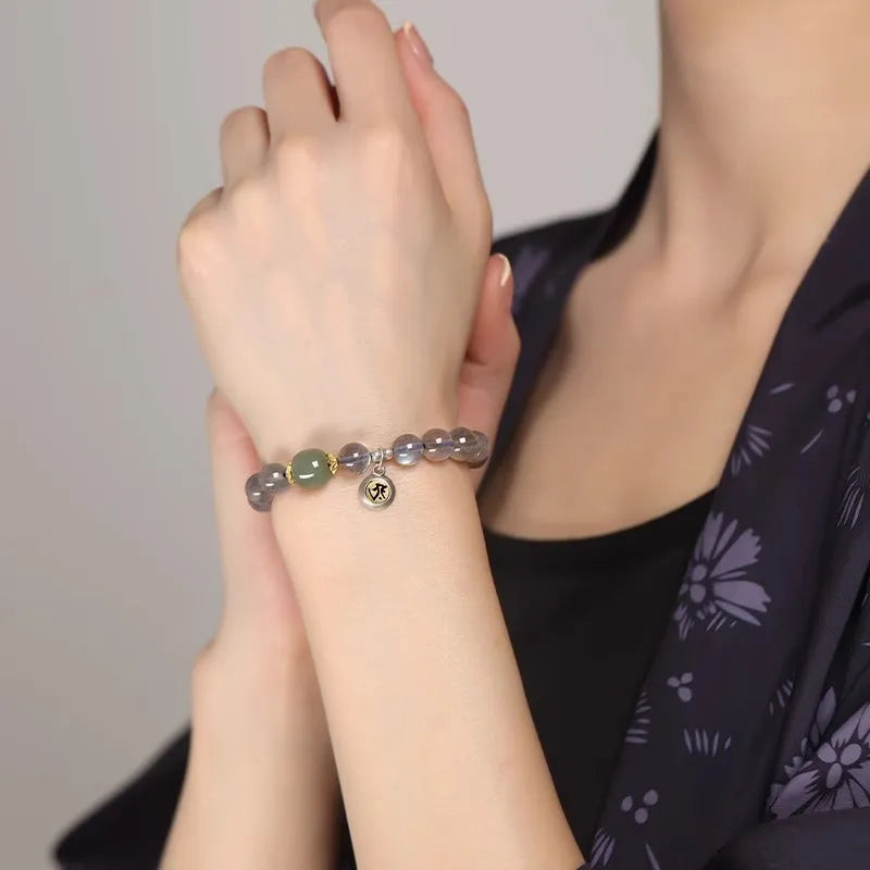 Moonstone women's bracelet with 8mm beads showing Thousand-Hand Kwan-yin mouse zodiac design and electroplated metallic finish