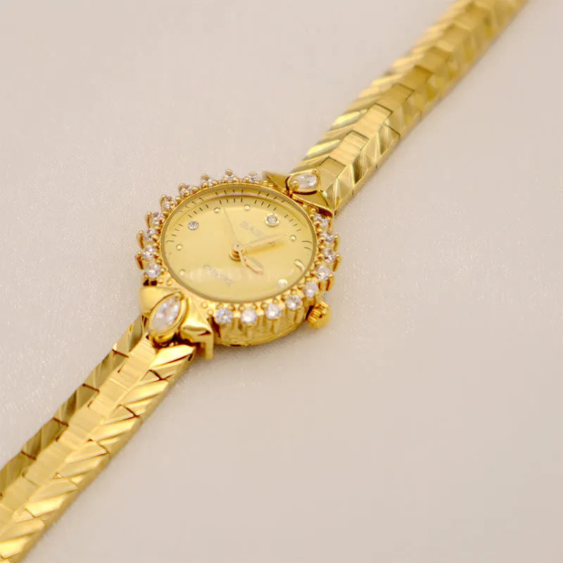 Women's quartz bracelet watch with gold dial and 5A diamond embossed pattern