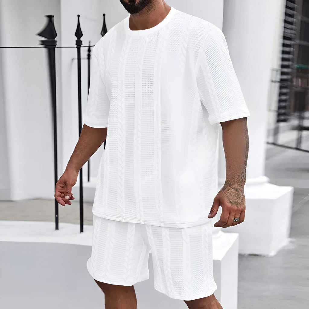 Knitted jacquard short sleeve pullover and matching shorts set in a solid colour on a hanger.