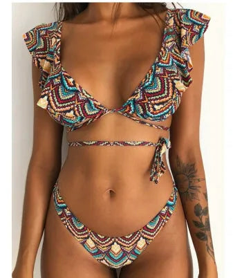 Yellow floral print split bikini swimsuit set with top and pants on a mannequin
