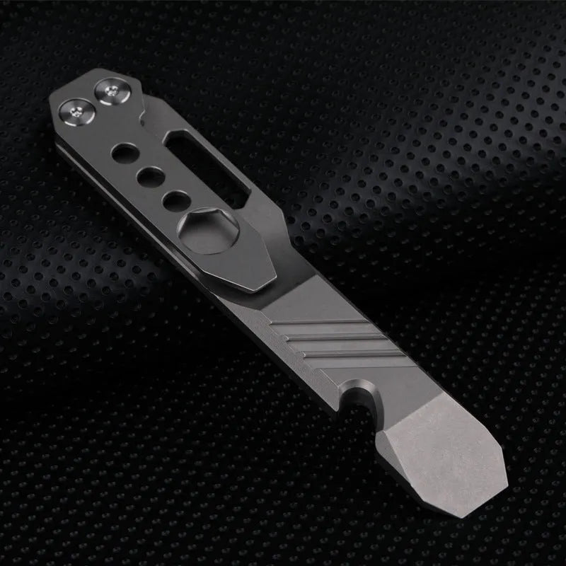 Titanium alloy multi-function crowbar tool with screwdriver tip and bottle opener in stone wash finish.