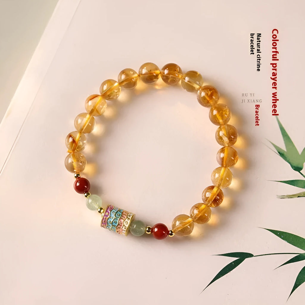 Yellow citrine bracelet with prayer wheel elements on 8mm round beads