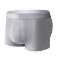 Men's solid colour mid-waist underwear made from milk silk fabric with integrated massage particles.