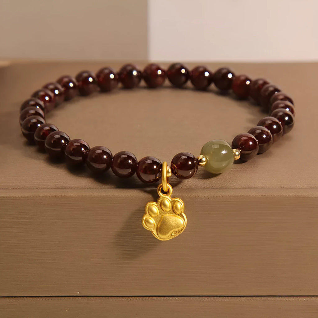 Women's Cat's Paw garnet style crystal bracelet on packaging