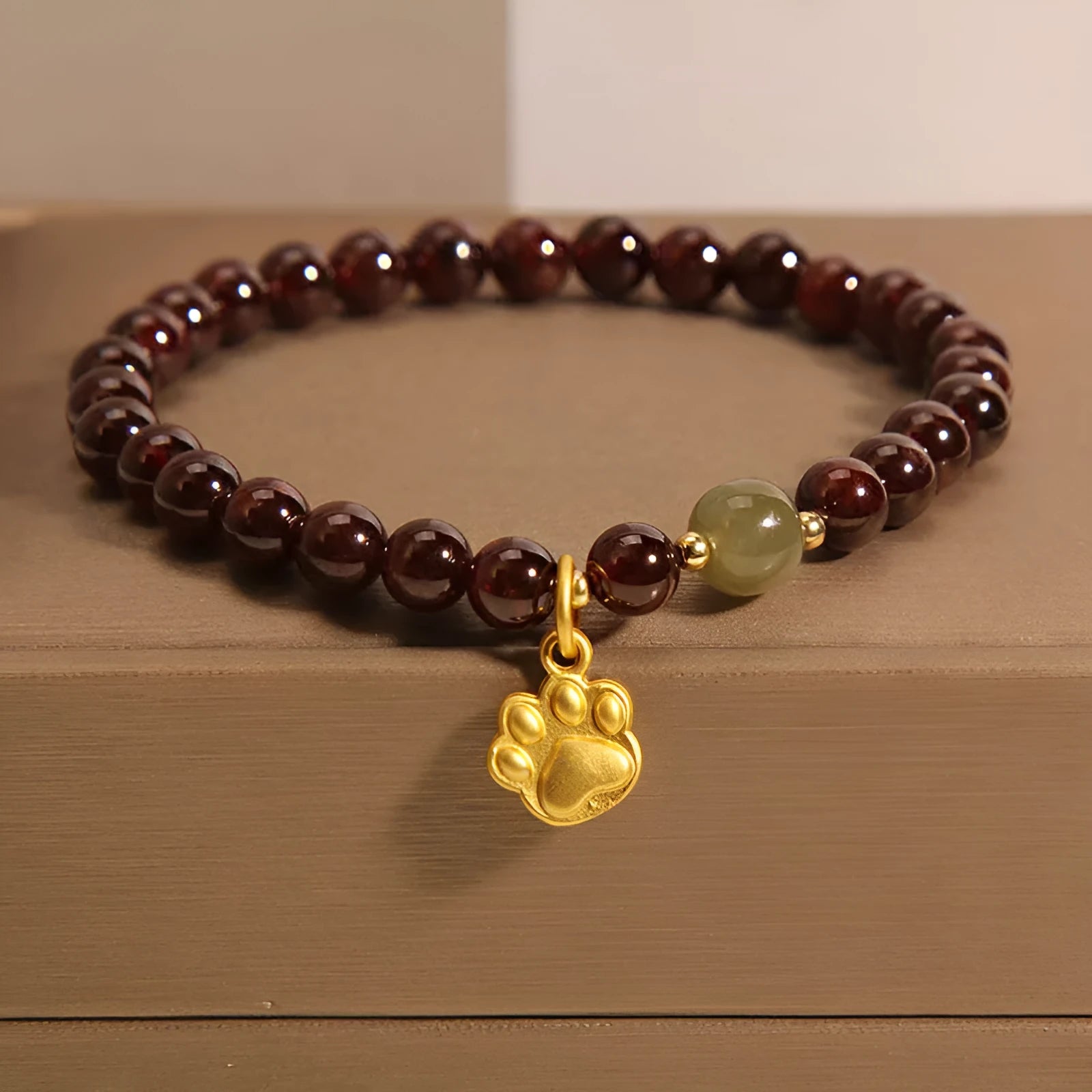 Women's Cat's Paw garnet style crystal bracelet on packaging