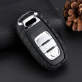 Carbon fibre silicone car key case in round button, single key or square key style, shown as a protective cover for car keys