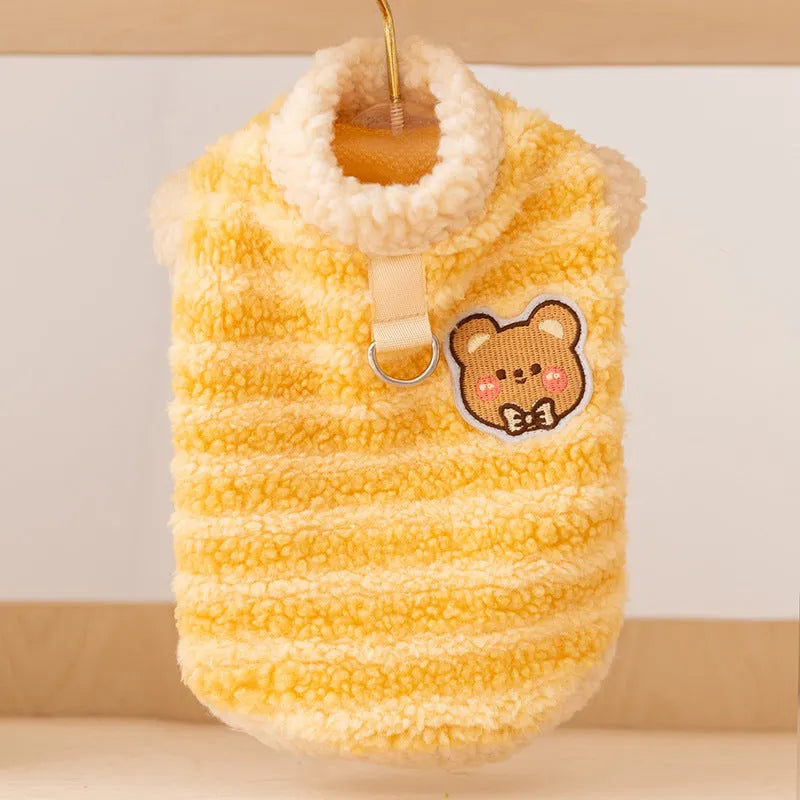Yellow striped lambskin fleece dog clothing with bear patch and leash ring on a small dog