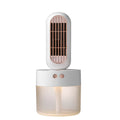 Small black and white humidifier fan with oscillating head on a table