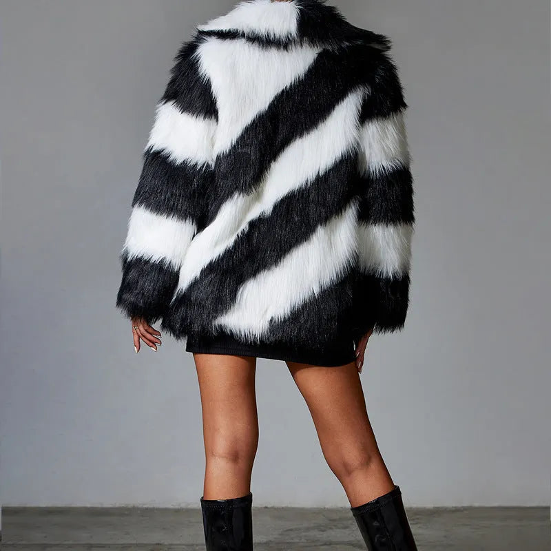 Women's faux fur coat with contrast colour lapel and a matching fur collar.
