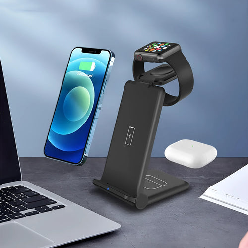 White 3-in-1 foldable wireless charging station charging an iPhone, Apple Watch, and AirPods on a desk.