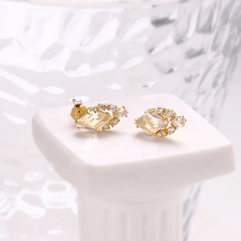 Geometric silver earrings with white crystal studs on 925 silver backing