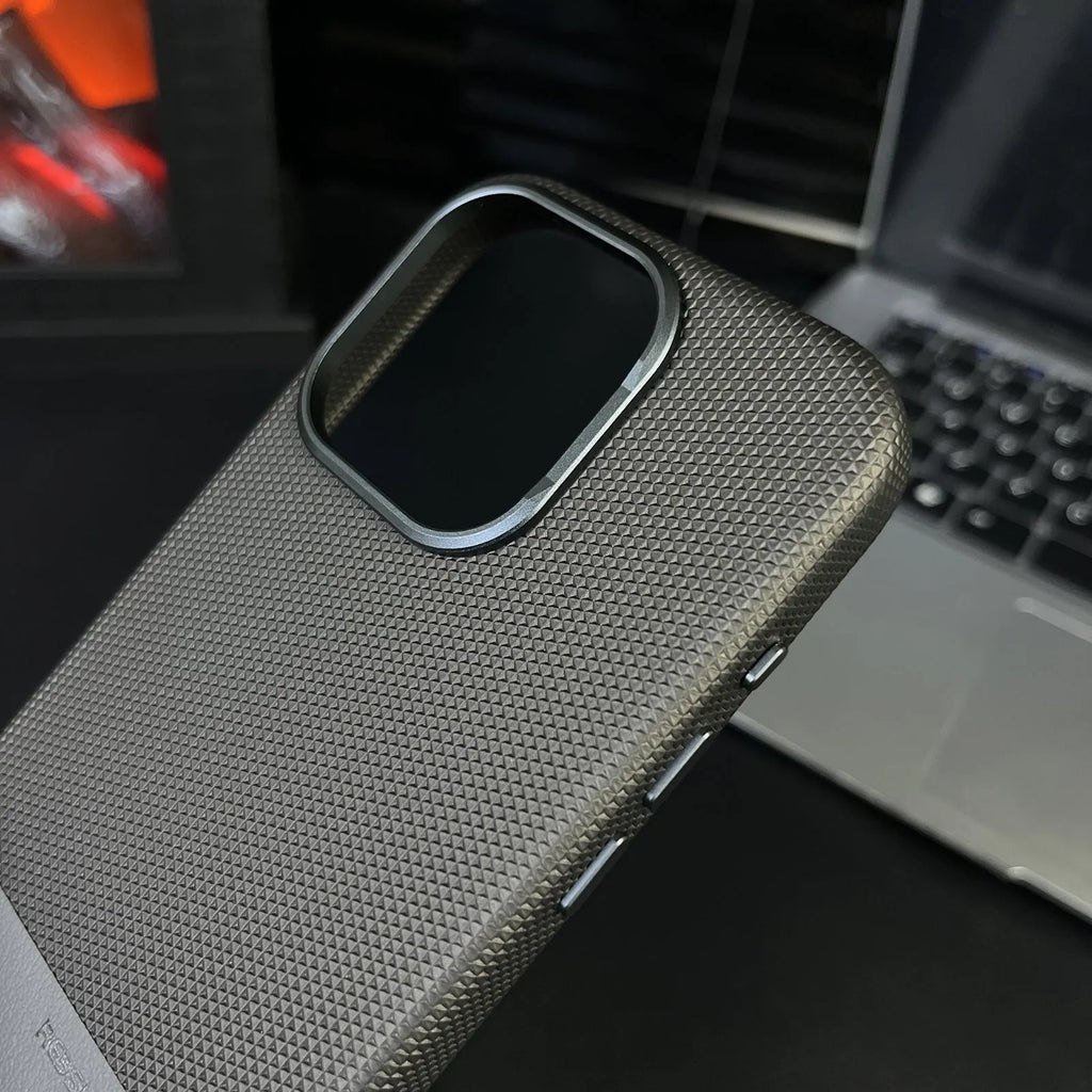 Black iPhone case with dragon scale texture and stitching design, showing magnetic ring on back.