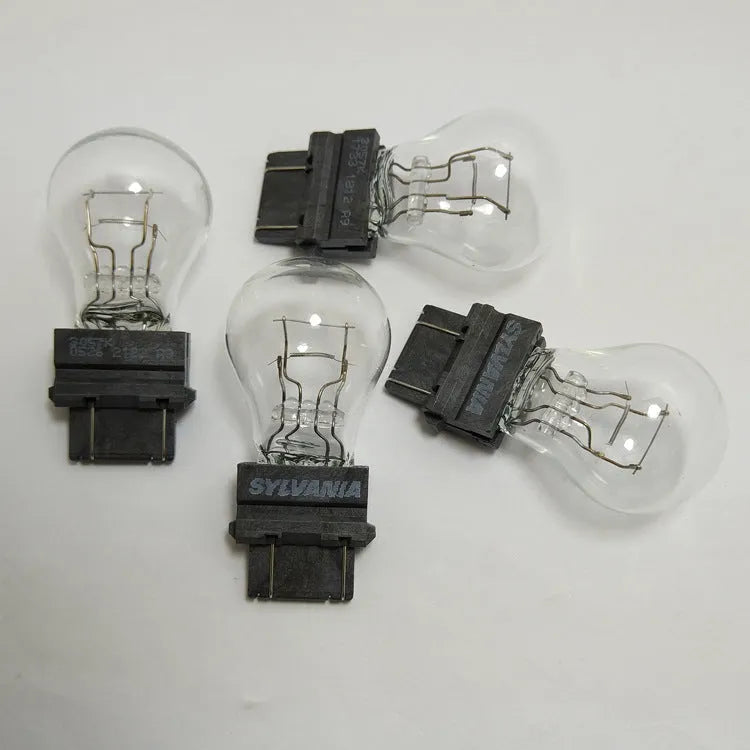 Wagner brake light bulb with dual wires, plastic alignment dots, and 16mm socket