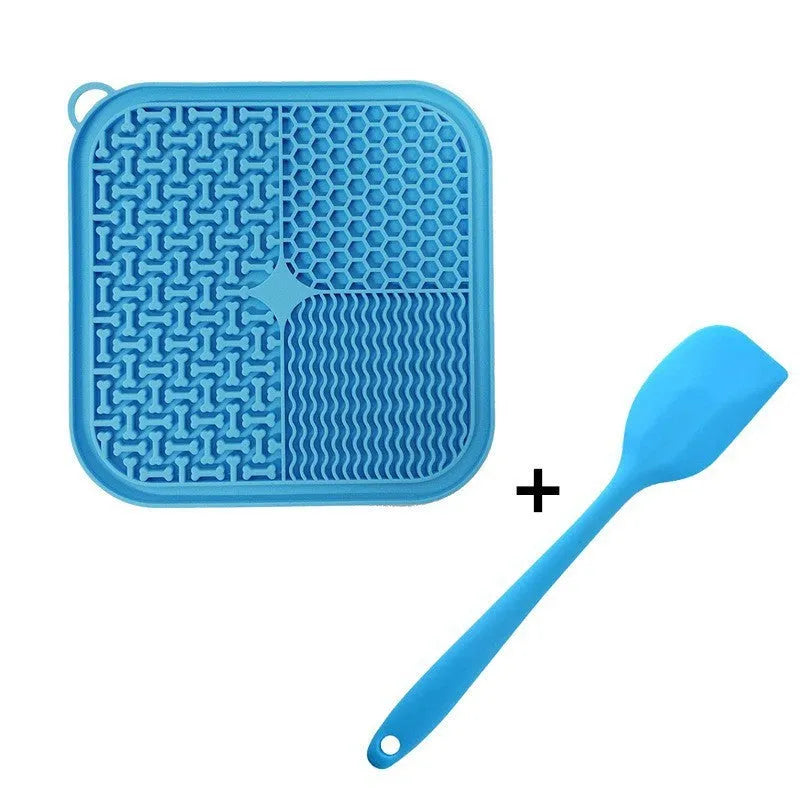Square orange silicone dog licking mat with textured surface and suction cups on back.