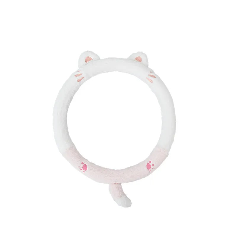 Plush rabbit fur winter steering wheel cover with cute embroidered panda design, shown fitted on a car steering wheel.