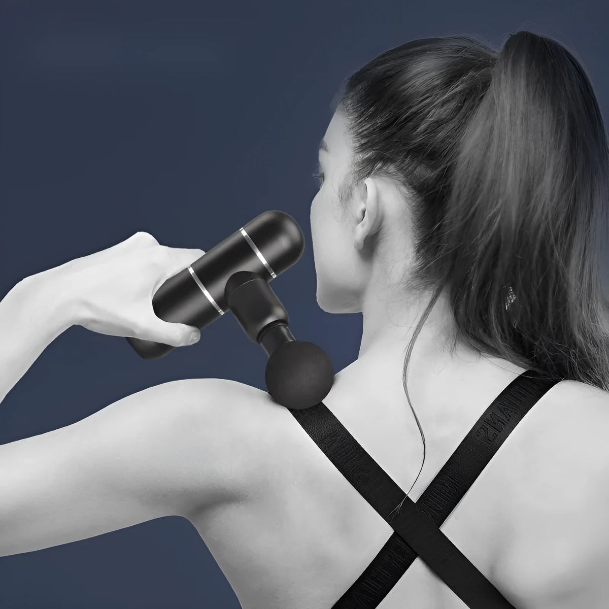Mini fascia gun massage gun in black with four massage heads, 580g body, and USB charging cable
