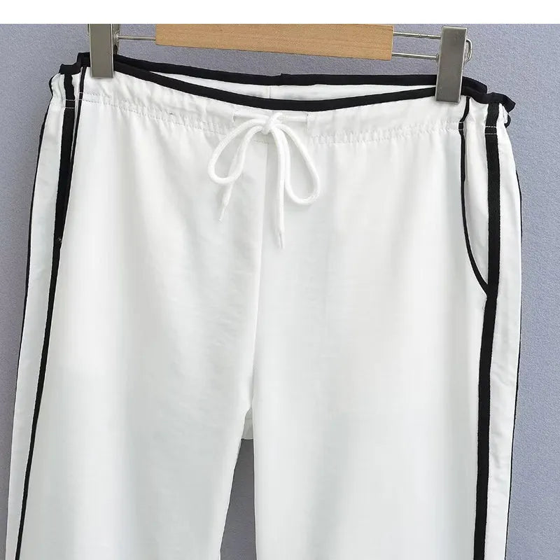 Women's navy blue loose straight pants with white contrast ribbon parallel bars detail and low waist