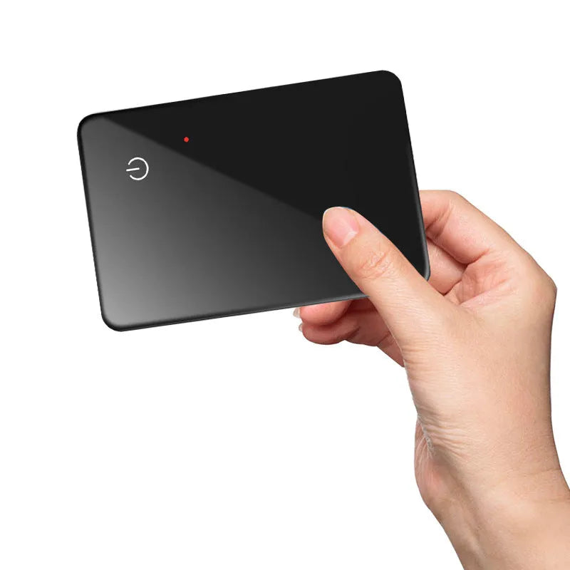 Black card-shaped pet tracker with wireless charging and NFC, showing hanging hole.