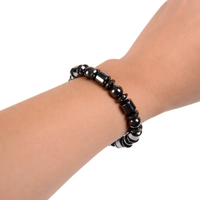 Black stretch bracelet with pentagram stone design, made from magnetite and hematite.
