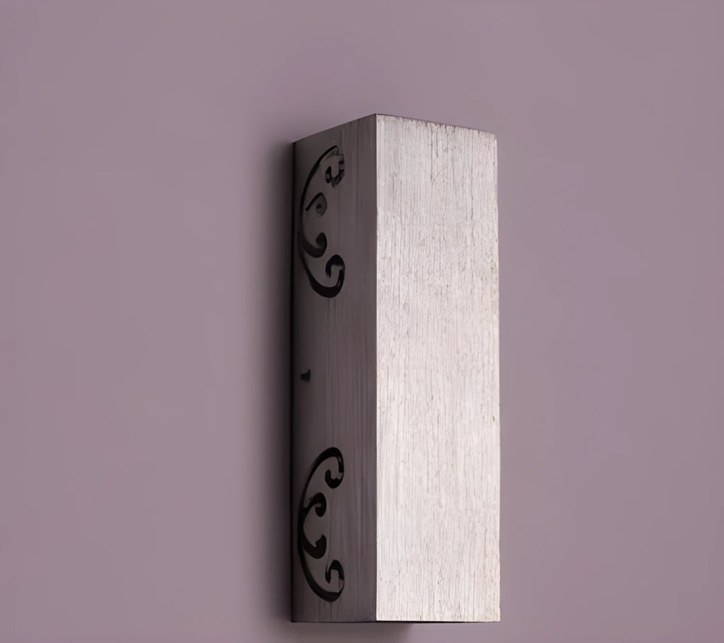 Colourful butterfly-shaped aluminium LED wall lamp mounted on a wall for accent lighting.