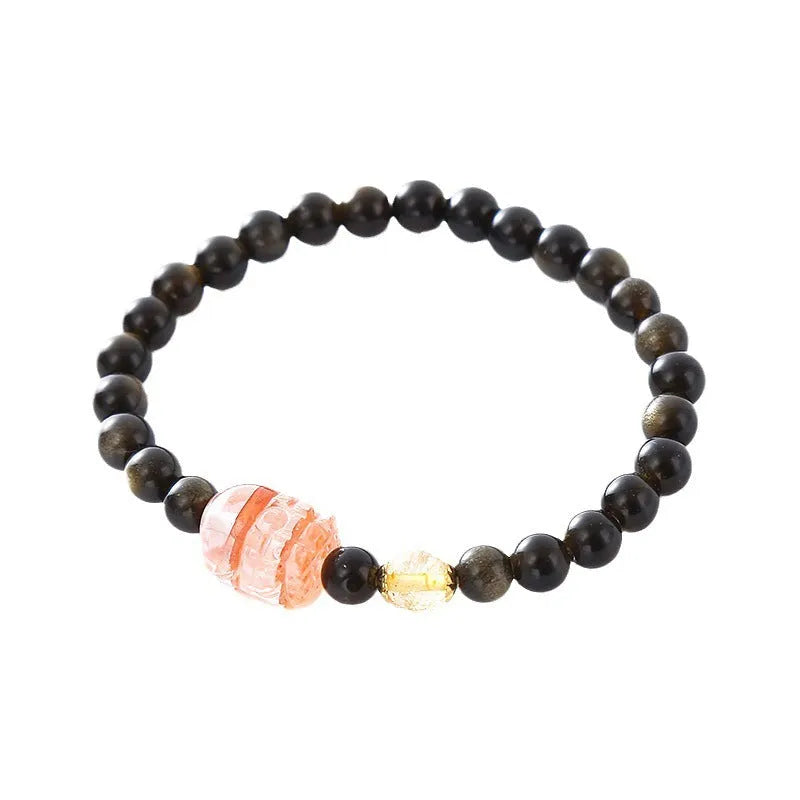 Handcrafted natural obsidian Pi Xiu bracelet in gold obsidian and red flower colours on wrist