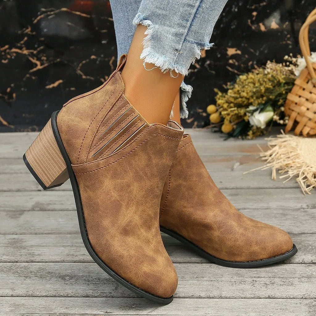 Women's black ankle boots with pointed toe and thick square heel slip-on design
