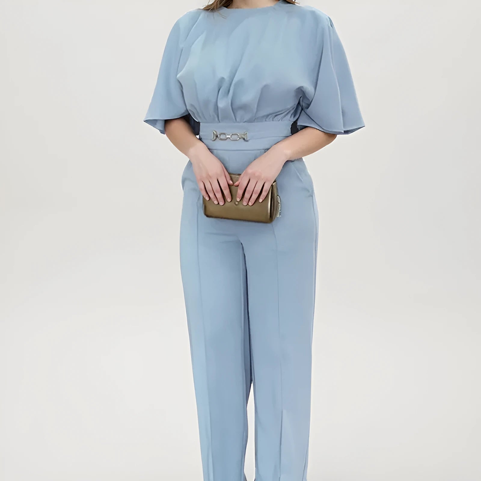 Men's blue slim-fit polyester suit with trousers and long sleeves on a hanger