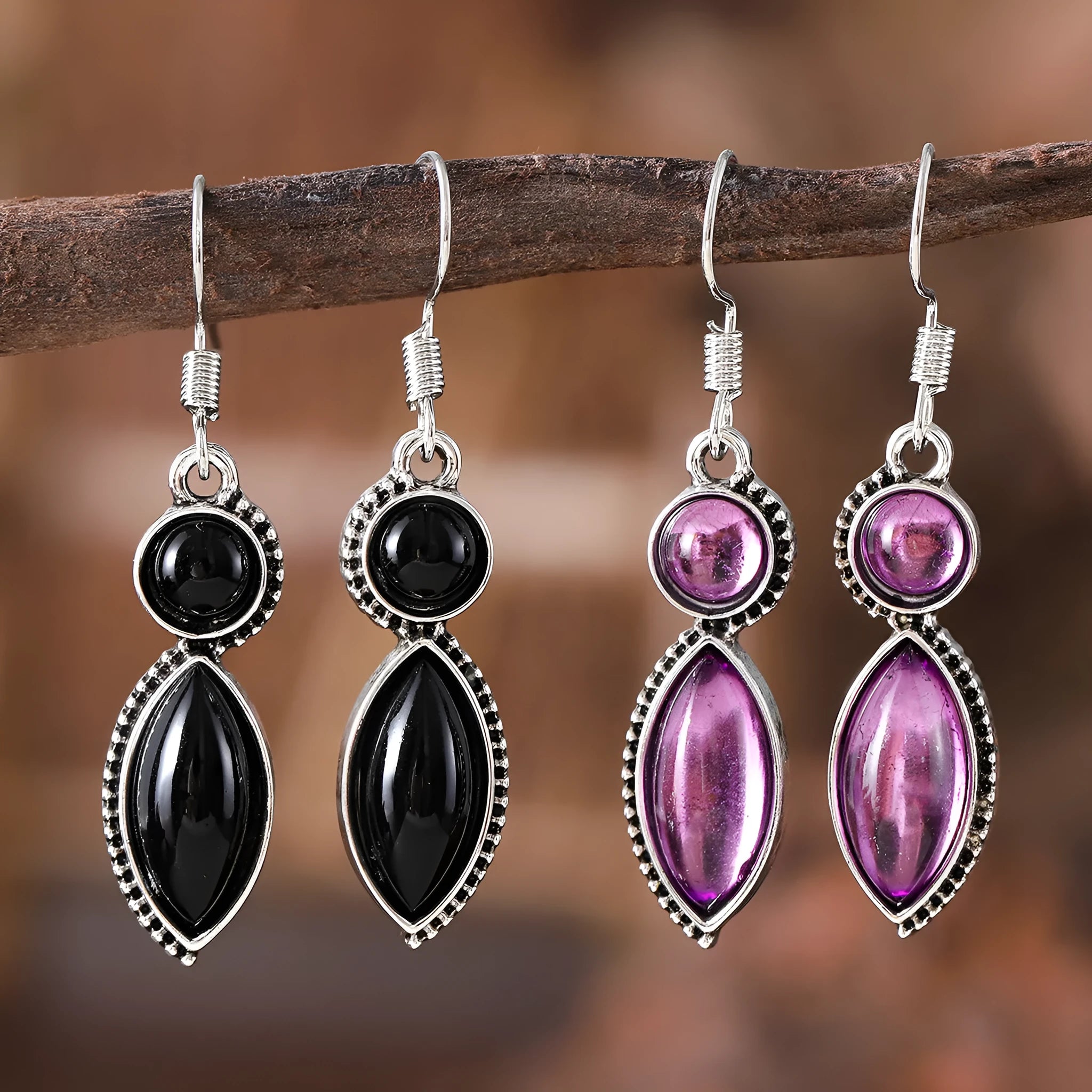 A pair of vintage geometric pendant earrings in black and purple with a round detail, made from zinc alloy.