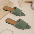 Women's flat denim slippers with a tassel detail in apricot colour on a white background