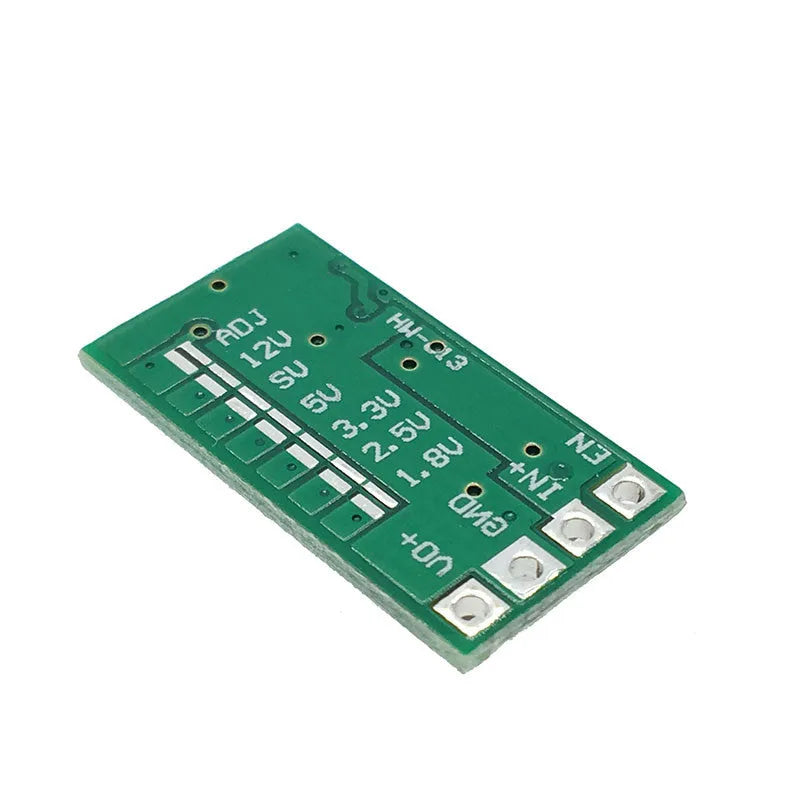 Green mini DC-DC buck converter module stepping 12-24V down to 5V 3A output.