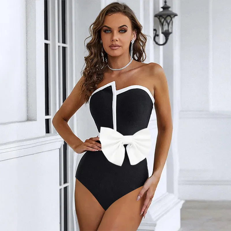 Women's black and white colour-block one-piece swimsuit with bow detail and tube top neckline