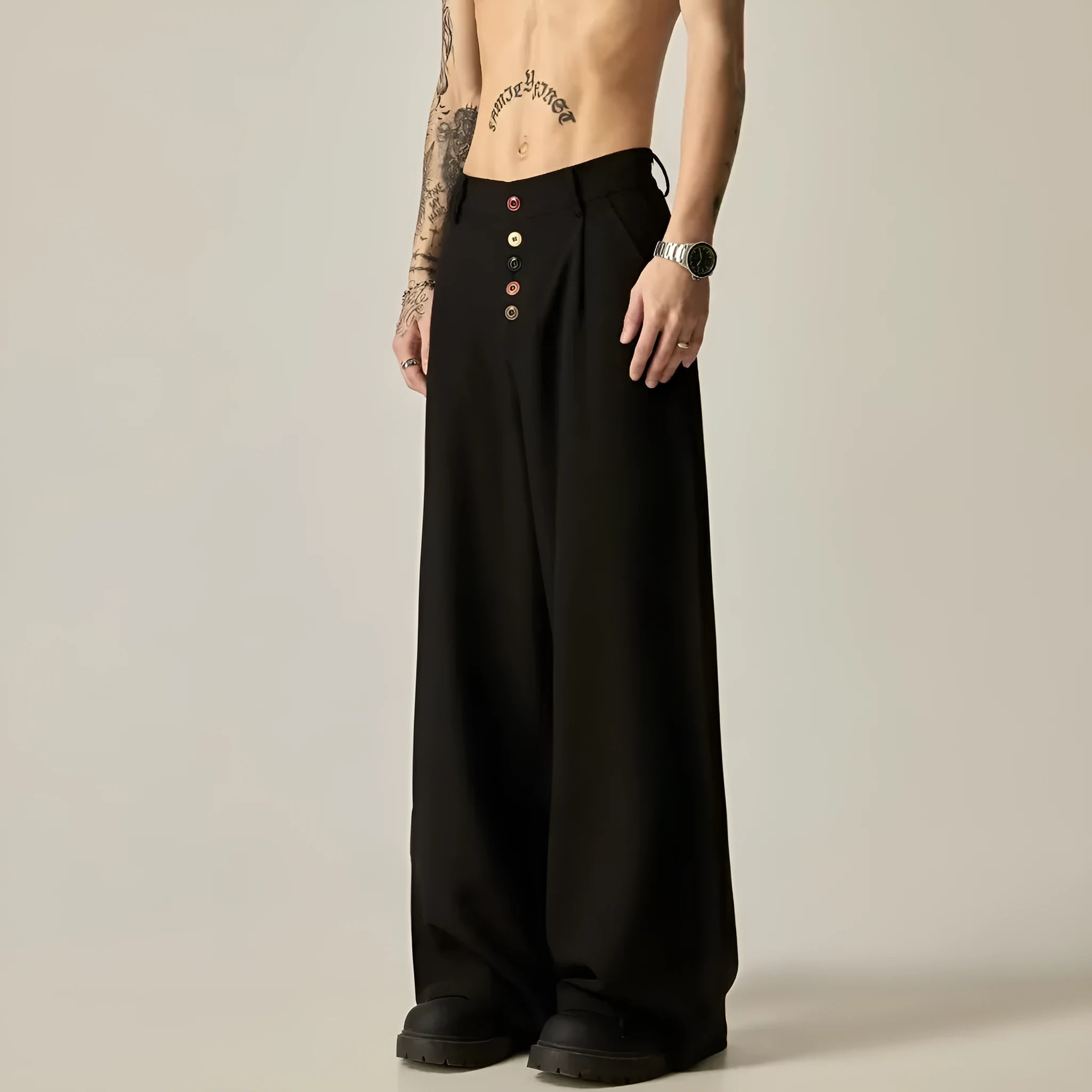 Men's solid black wide-leg casual trousers with a vertical tube design on a mid-waist.