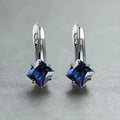Pair of women's copper earrings with a diamond design and inlaid zircon detailing.