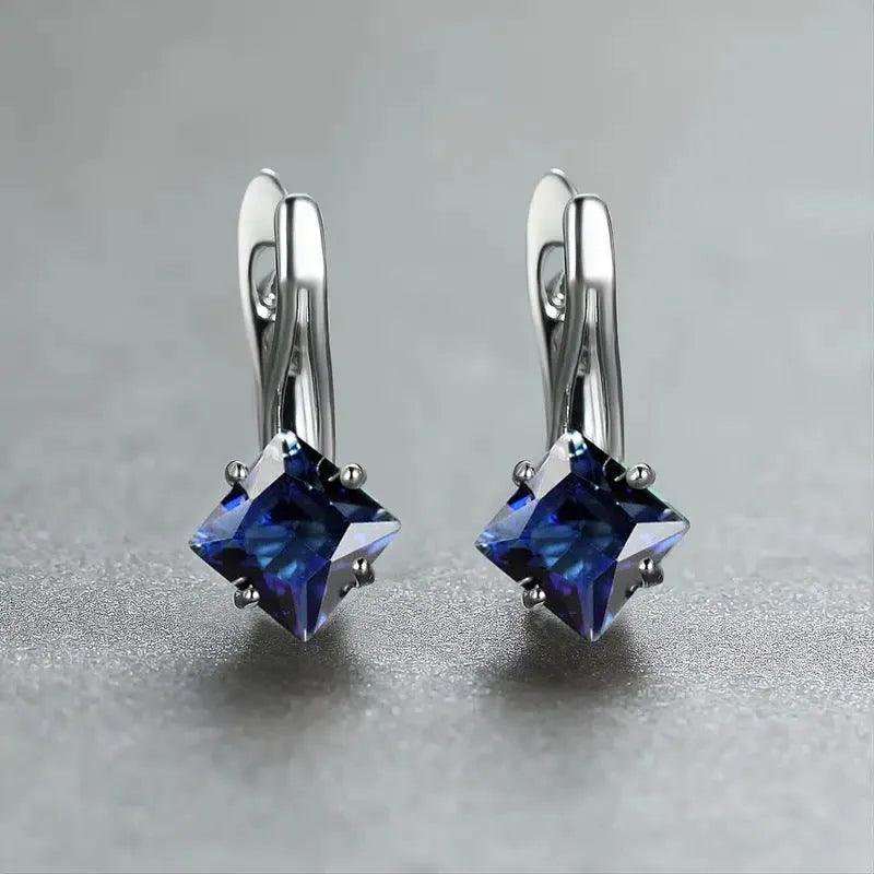 Pair of women's copper earrings with a diamond design and inlaid zircon detailing.