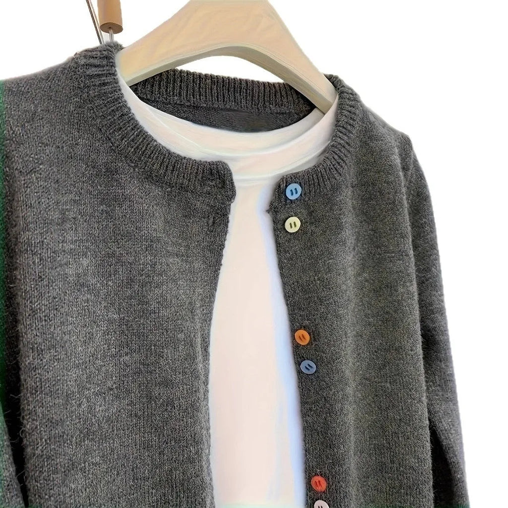 Dark grey women's button-up cardigan sweater with long sleeves on a hanger.