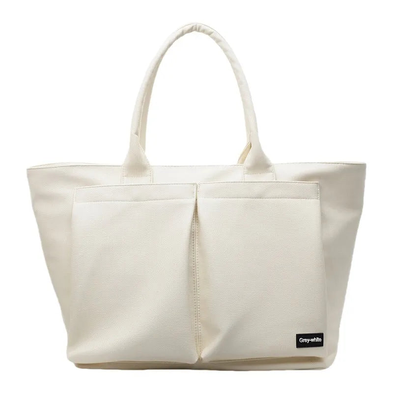 Sporty green PU shoulder bag with adjustable straps showing expandable compartments.